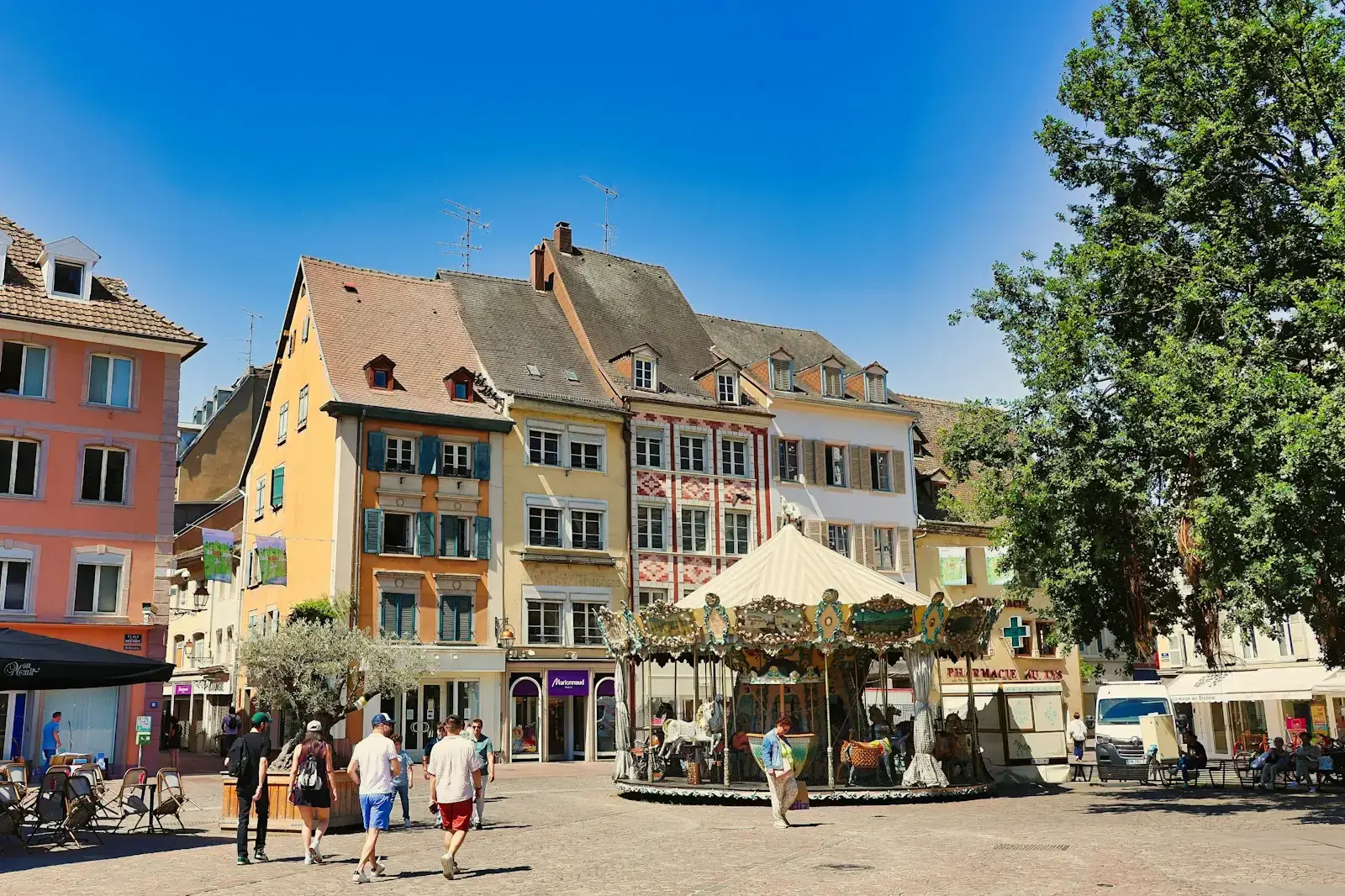 A picturesque european town square with a carousel.